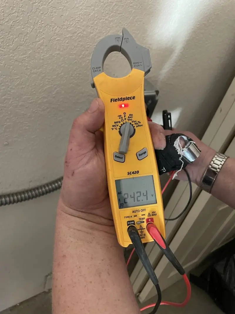 Voltage testing with clamp meter during Ceiling Fan Installation in Mullins